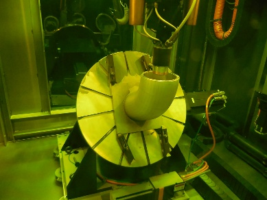 DED manufacturing chamber with active laser cladding